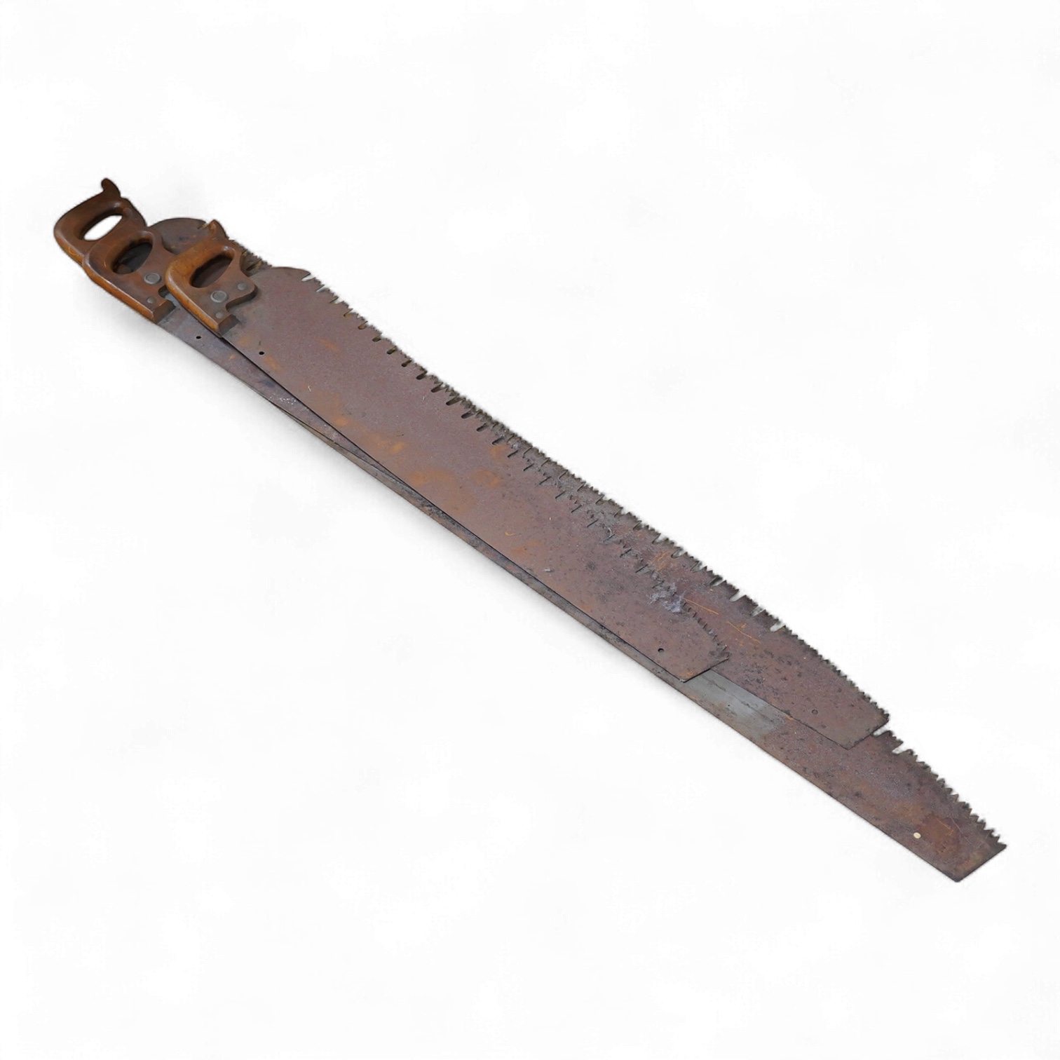 Three large Henry Disston and Sons, Philadelphia, U.S.A. early 20th century hand saws, the largest with a 5’ blade, the makers name still clear on two of the blades, all with similar style wood handles